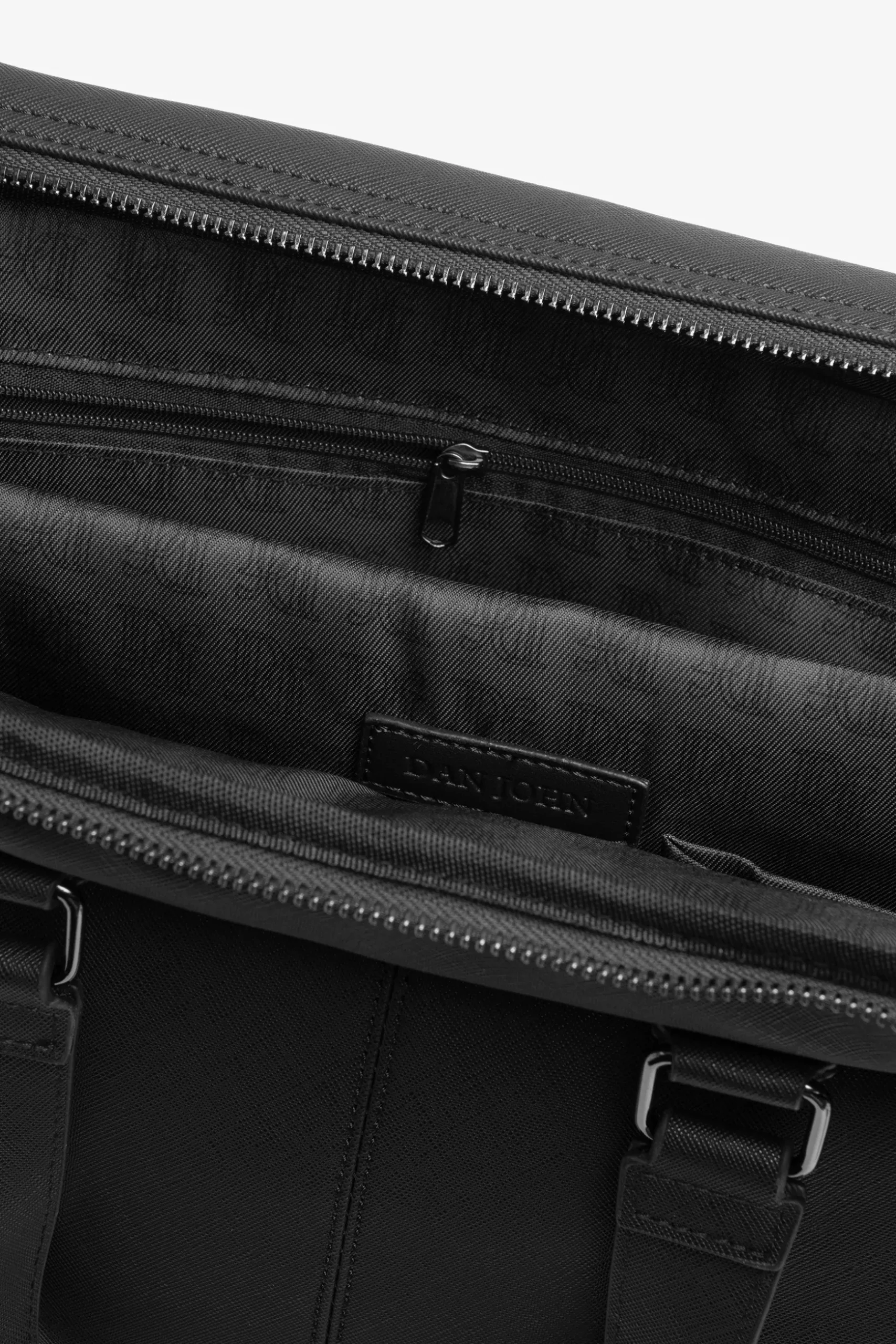 Black faux-leather overnight bag