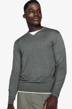 Green V-neck sweater