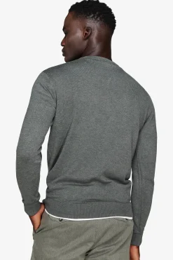 Green V-neck sweater
