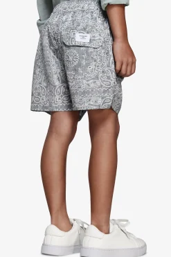 KIDS Sage floral print swim trunks