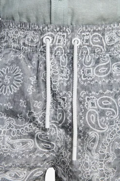 KIDS Sage floral print swim trunks